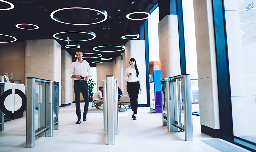coworkers passing checkpoint at workplace